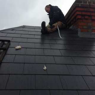 Worker carring out roofing services in Nottingham