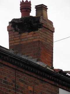 Damaged chimney before